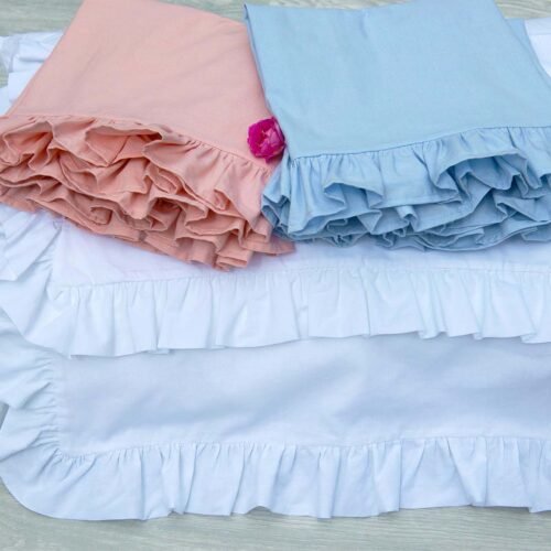 Bespoke cotton pillowcases with ruffles all around them in the colours white, baby pink or baby blue