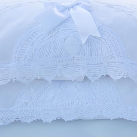 white cotton pillowcases embellished with handmade lace trims and hand embroidery