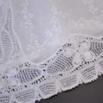 baby christening gown lavishly embellished with hand made lace trims and hand embroidered