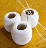 three big white thread balls for hand embroidery