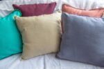 multi-coloured linen cushion covers with edging lace trims