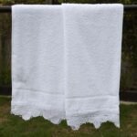white hand towel Egyptian Cotton with a wide handmade lace Trim on one end
